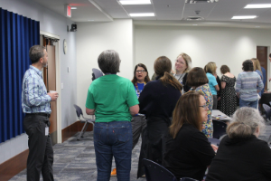 group of people talking in a circle