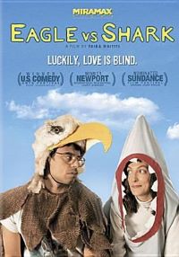 Two adults one in eagle costume, one in shark costume