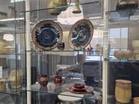 pottery displayed in glass case