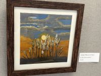 Landscape painting with cloudy blue sky, setting sun, wheat