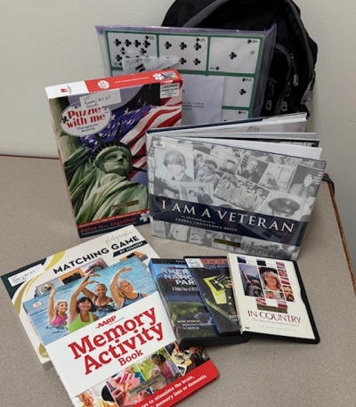 books and activities in front of a backpack