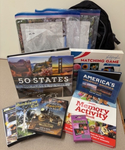 books and activities in front of a backpack