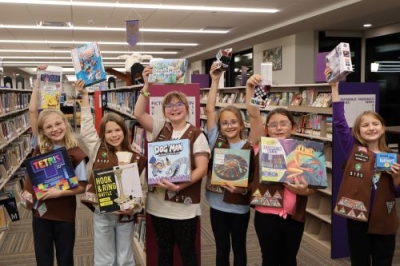 Girl Scouts donate games