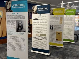 four large vertical panels detailing life of Lavinia Goodell
