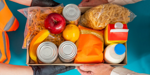 box of canned goods, milk, fruit, past, being handed from one person to another