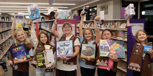 Girl Scouts donate games