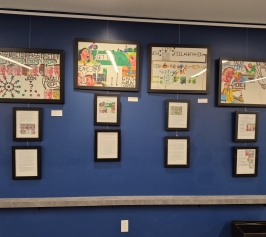 Four framed Staedtler marker drawings each with 2 framed narratives describing the pieces of artwork.