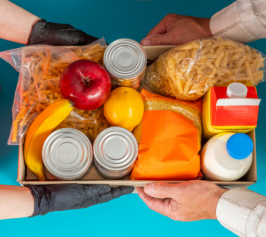 box of canned goods, milk, fruit, past, being handed from one person to another
