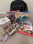 books and activities in front of a backpack