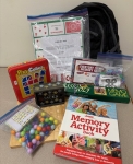 games, books and activities in front of a backpack