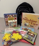 books and activities in front of a backpack