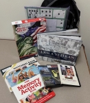 books and activities in front of a backpack