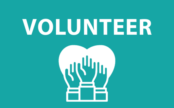 the word volunteer with three hands in front of a heart