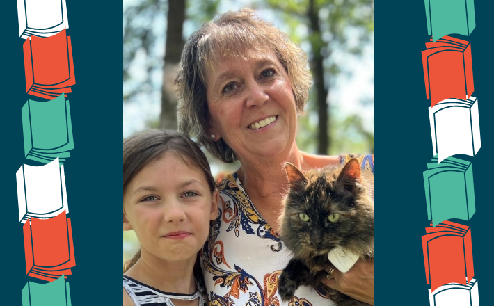 woman with young girl holding cat