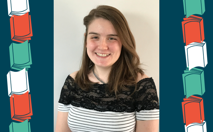 woman with brown hair smiling at camera