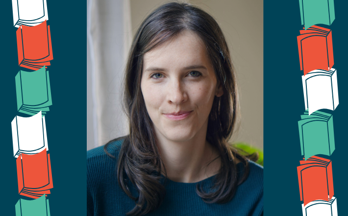 Woman with long dark hair smiling at camera
