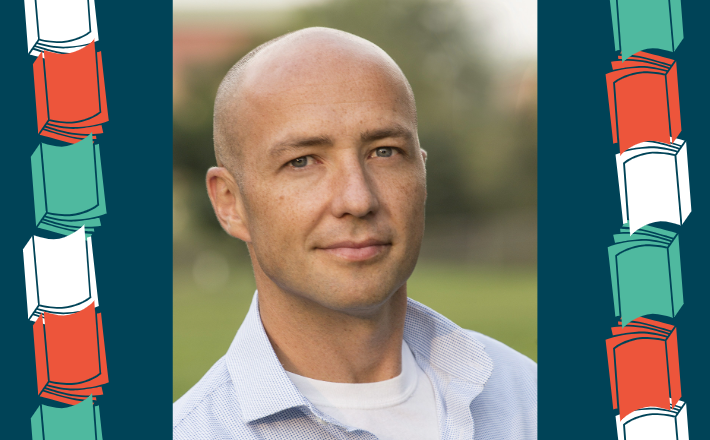bald man wearing button up shirt looking at camera