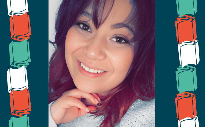 woman with dark hair smiling at camera